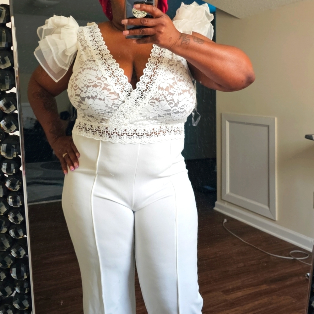 White ruffle arm jumpsuit brand new never worn with tag. Good for special occasi